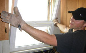 kitchen vinyl window being installed