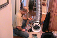 crew using duct blaster on an energy audit in Oakland