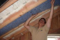 crew installing underfloor insulation for increased energy efficiency