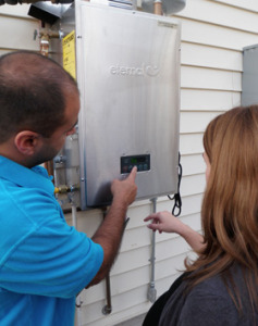 crew instructing Berkeley homeowner on hybrid water heater use