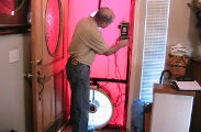 conducting a blower door test during an energy audit