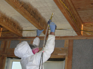 installing spray foam insulation on the ceiling
