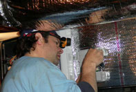 heating and cooling crew member installing a forced air unit